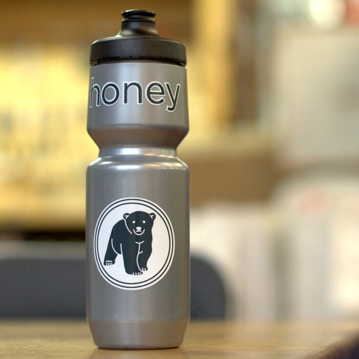 silver bicycle waterbottle with bear graphics