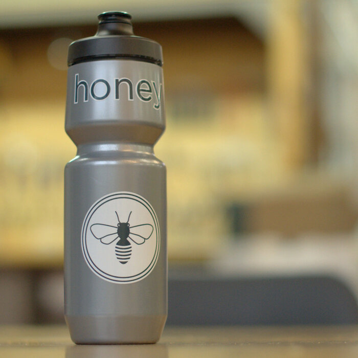 silver bicycle waterbottle with bee graphics