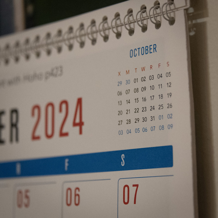closeup of print calendar showing next month in upper right corner